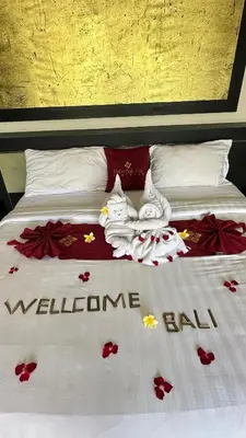 a bed with towels on it with the words welcome inn at 1 Bed Room Private Pool Villa in Seminyak - PBM1 in Seminyak