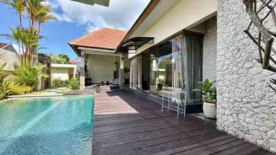 a house with a swimming pool next to a house at 1 Bed Room Private Pool Villa in Seminyak - PBM1 in Seminyak