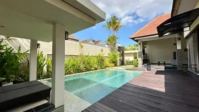 a swimming pool in the backyard of a house at 1 Bed Room Private Pool Villa in Seminyak - PBM1 in Seminyak