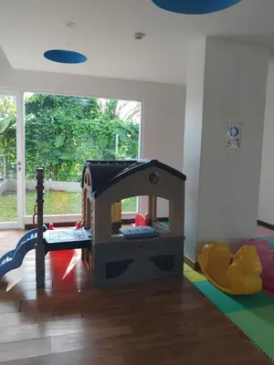 a childs play room with a toy house at Cozy Apartement in Seminyak in Uluwatu