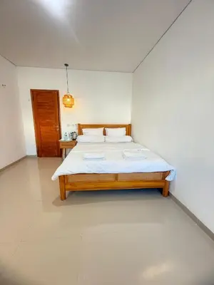 a bedroom with two beds in a room at Home Stay Room in Bali Near Sanur Beach in Sanur