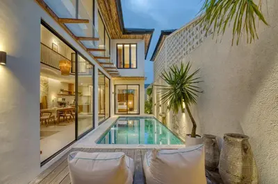 a swimming pool in the backyard of a house at Casa Amadeo Villas Seminyak in Seminyak