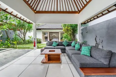 a living room with a couch and a table at Balima Villa in Seminyak
