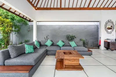 a living room with a couch and a coffee table at Balima Villa in Seminyak