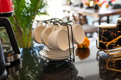 a group of white plates on a holder on a table at Villa Vela 1 - Brand new 3 bedroom villa in Seminyak