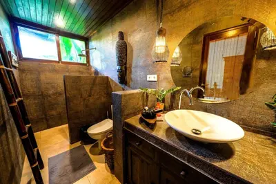 a bathroom with a sink and a toilet at Villa ABBI Luxury 2 Bedroom Villa - Legian Seminyak in Seminyak