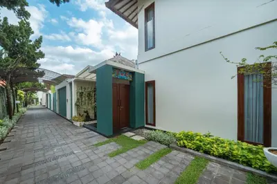 a walkway in front of a white building at The Cemara Umalas in Kerobokan