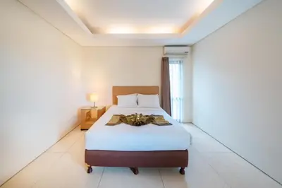 a bedroom with a bed in a room at The Cemara Umalas in Kerobokan