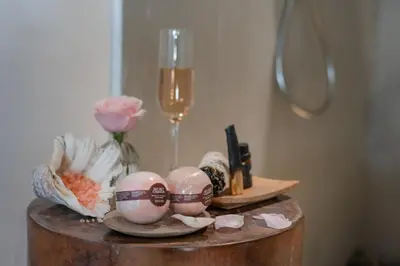 a table with easter eggs and a glass of champagne at Semesta Collection Seminyak Villas in Seminyak