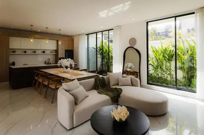 a living room with a couch and a table at Villa Toku by BaliSuperHost in Seminyak
