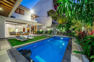 a swimming pool in the backyard of a house at Villa Lebah Seminyak in Seminyak