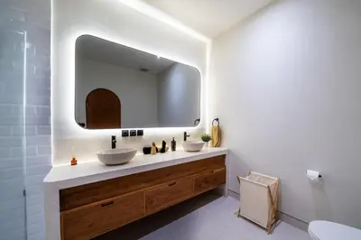 a bathroom with two sinks and a large mirror at New Luxury villa walk to Atlas, Finns and Berawa beach in Canggu