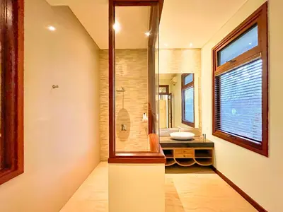a bathroom with a sink and a mirror at Villa Michelle Bali in Seminyak