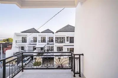a view from the balcony of a white building at Aurelia Home at Mogan Residence in Seminyak