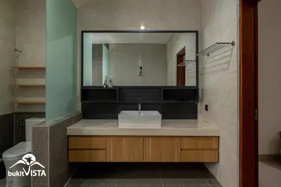 a bathroom with a sink and a mirror at Serayu Mertanadi by Bukit Vista in Seminyak