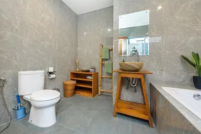 a bathroom with a toilet and a sink at Adikara Villa 2 Cozy 2BR in Canggu, Berawa 5 mins to the beach in Canggu