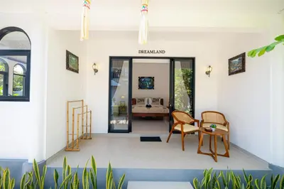 a hallway of a house with a table and chairs at Crystal Flow Guest House & Apartment Canggu in Canggu
