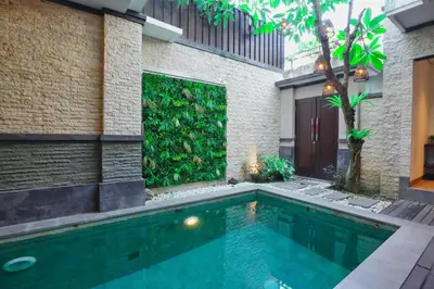 a swimming pool in the backyard of a house at Luxury Villa 3br 5min to Seminyak beach in Seminyak