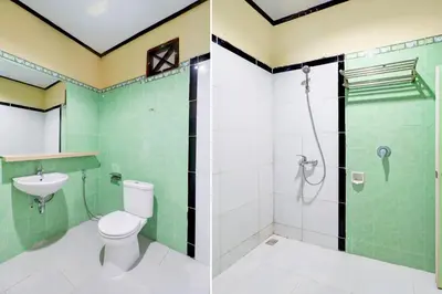 a bathroom with a toilet and a shower and a sink at Townhouse Oak @lebak Bene Near Kuta Beach in Balian