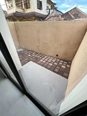 a view from a window of a courtyard at Luminera Bali Apartment in Nusa Dua