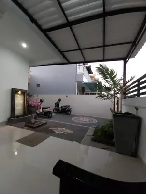 a room with two motorcycles parked in it at Omah Chandra in Pesanggaran