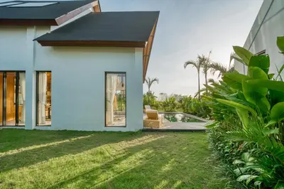 a house with a view of a yard at New! Designer Arch Villa with pool near Seminyak in Kerobokan