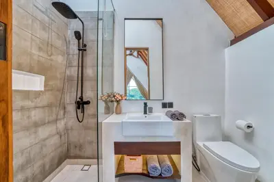 a bathroom with a sink and a shower at New Tranquil Jungle View Villa in Kerobokan in Kerobokan