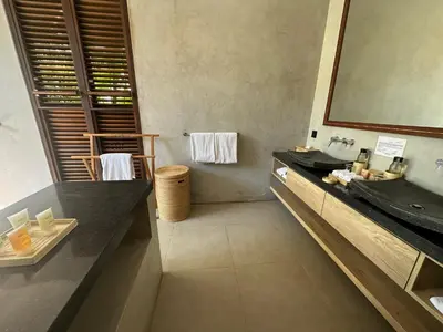 a bathroom with a sink and a mirror at Saba Villas in Canggu