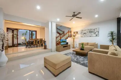 a living room with a couch and a table at 5 Reviews, Huge Savings Best Locale In Seminyak in Badung