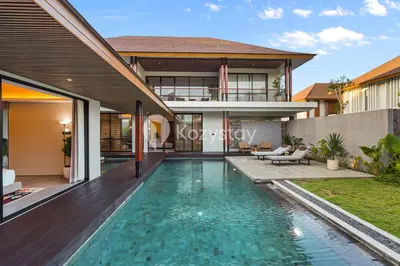 a swimming pool in the backyard of a villa at Andra Villa by Kozystay - Natadesa Resort Jimbaran in Jimbaran