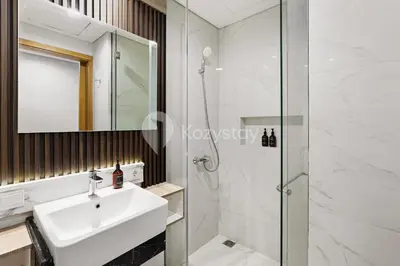 a bathroom with a sink and a shower at Caraya by Kozystay - Nusa Dua in Nusa Dua