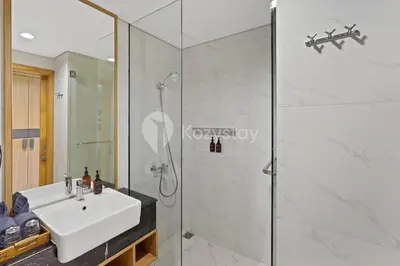 a bathroom with a shower and a sink at Levora by Kozystay - Nusa Dua in Nusa Dua