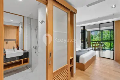 a bathroom with a shower and a sink at Levora by Kozystay - Nusa Dua in Nusa Dua