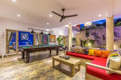 a living room with a pool table in it at Villa Josefine, 5 Bedroom pool, rooftop, pool table in Seminyak