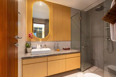 a bathroom with a sink and a shower at Villa Narda Seminyak by Nagisa Bali in Legian