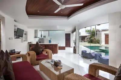 a living room with a couch and a table at Villa K Seminyak by Premier Hospitality Asia in Seminyak