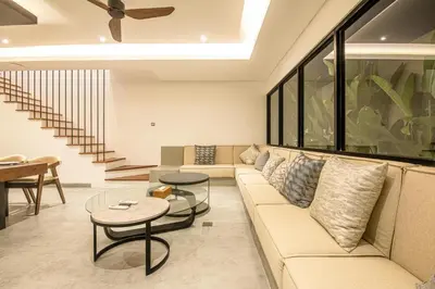 a living room with a couch and a table at Serene 5-Bedroom Villa 400 m from Batu Bolong in Canggu