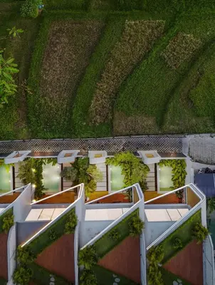 an overhead view of a building with plants on it at Modern 2BR Design Haven with green views, rooftop in Kerobokan