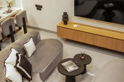 a living room with a couch and a coffee table at Contemporary 2BR Luxury Villa with Rooftop View and Pool in Kerobokan