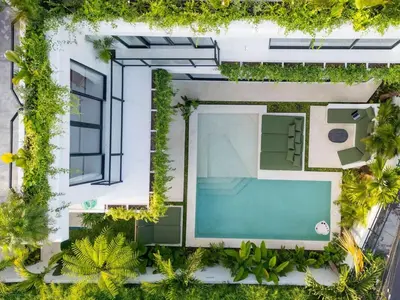 an overhead view of a building with a swimming pool at Rooftop Villa Elegant 4BR Retreat in Umalas in Kerobokan