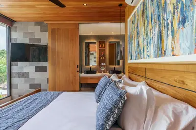 a bedroom with a large bed and a bathroom at Luxury Resort of 4 villas 11 BR Seminyak in Seminyak