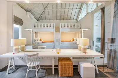a room with a desk and two bunk beds at Villa Shankara 1 in Canggu