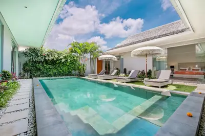 a swimming pool in the backyard of a villa at Villa Shankara 1 in Canggu
