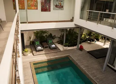 an overhead view of a swimming pool in a building at Villa Avrora Batubelig in Canggu