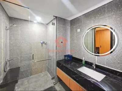 a bathroom with a shower and a sink and a mirror at Lavaya Resort 1BR Nusa Dua Pool, WiFi, Netflix in Nusa Dua