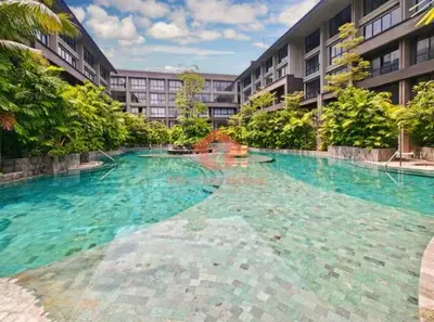 a large swimming pool in front of a building at Lavaya Resort 1BR Nusa Dua Pool, WiFi, Netflix in Nusa Dua