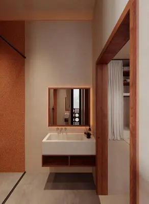 a bathroom with a white sink and a mirror at Gate 11 Apartments in Denpasar