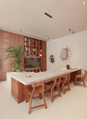 a large dining room with a large table and chairs at Gate 11 Apartments in Denpasar