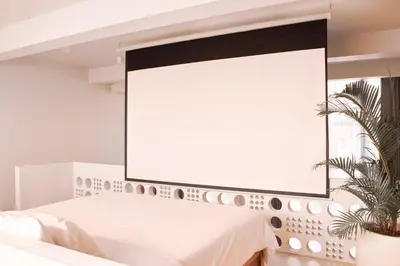 a large mirror above a bed in a bedroom at Gate 11 Apartments in Denpasar