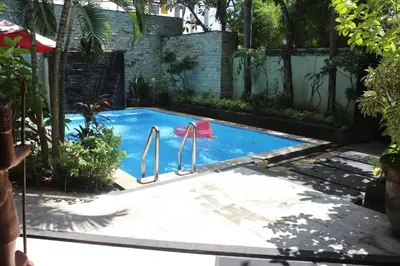 a small swimming pool with a red toy in it at Marinos Place Legian in Legian
